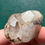 Thumbnail: Raw natural phantom quartz with hematite point, rare record keeper