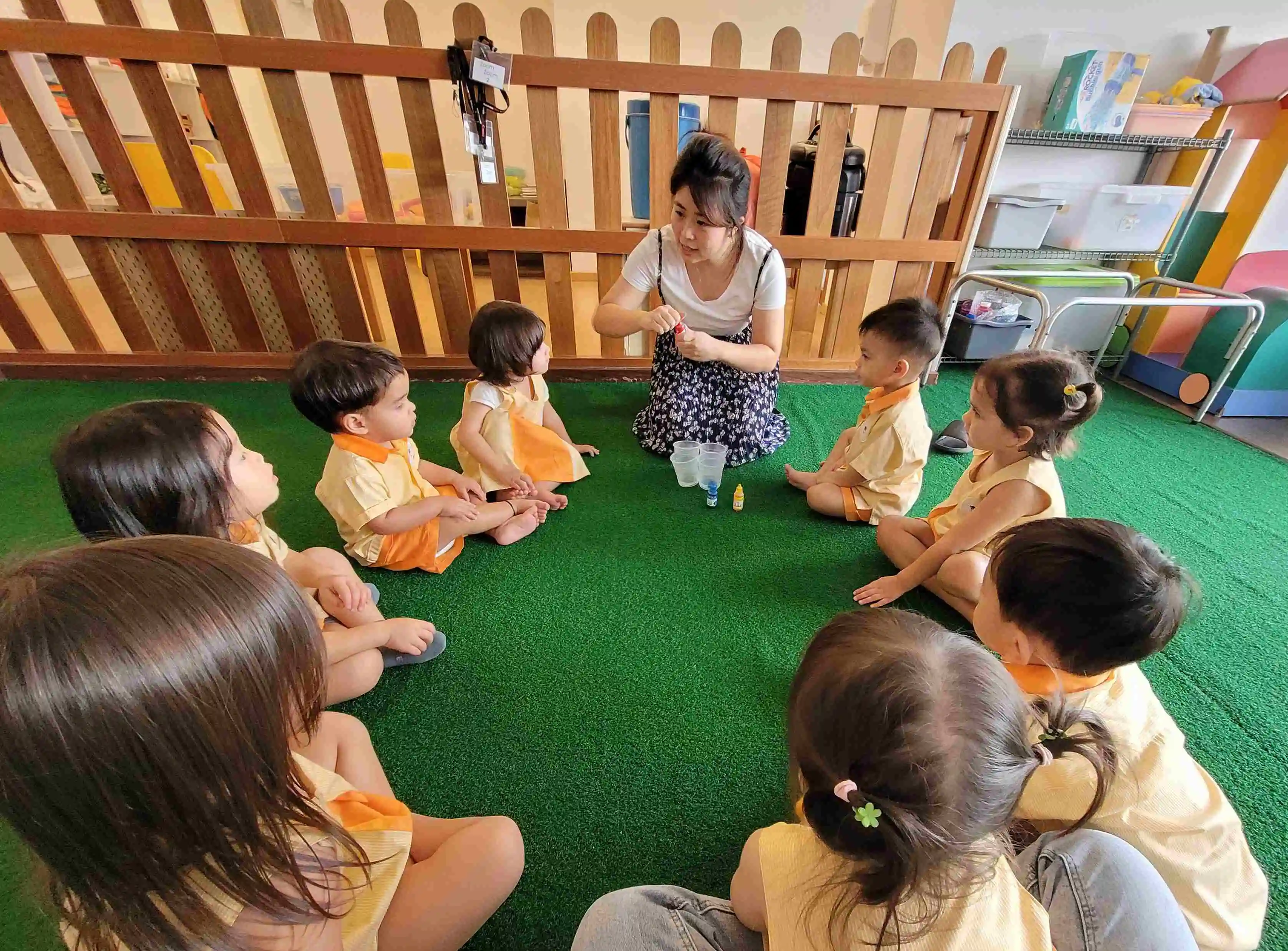 Preschool in East coast road- Teacher interacting with preschoolers
