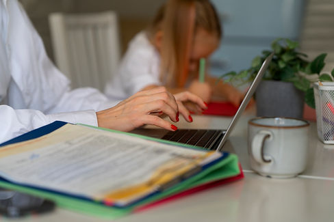 mother-working-from-home-trying-balance-family-life-with-child-job.jpg
