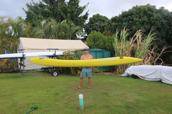 Kai Bartlett holding Kai Wa'a Lele OC6 ama in yard