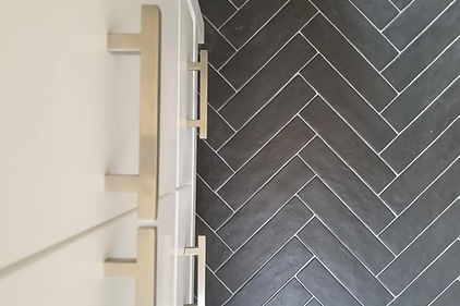 Herringbone Tile Pattern in Black with White Grout Lines - Bathroom Floor by Good Choice Contracting, Toronto.