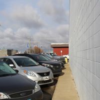 A parking lot adjacent to the Westlock Memorial Hall, conveniently located just off of Main Street. The parking lot offers ample space and is designated for free parking for all hall attendees. 