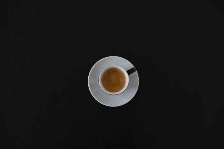white ceramic coffee cup on white saucer