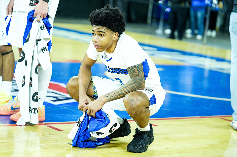 Holbrook Senior Allen Brown waits to receive his silver medal while watching Hoosac Valley celebrate their 91-76 win in the 2026 MIAA D5 Boys Basketball State Finals. Photo By ZANAYAH DASILVA