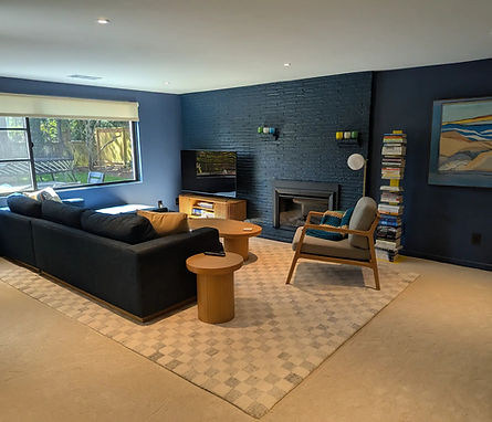 Decorated living room by Essential Organizing