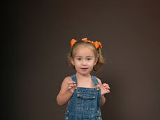 children's photography Niceville toddler posed in overalls for 3 year portraits
