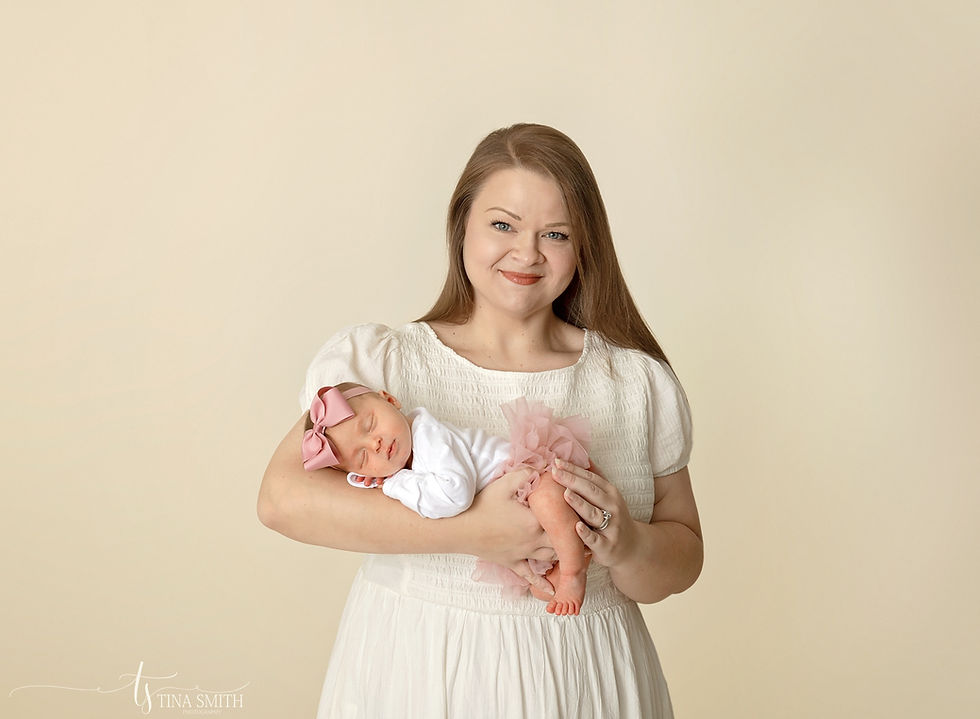 newborn photographer baby girl in pink