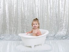Glamour Bathtub Milestone Session in Defuniak Springs Studio with sequins and white tub