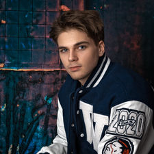 High school senior boy personality portrait showing confident natural expression