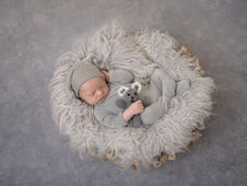 Sleepy newborn baby boy photographed in DeFuniak Springs FL newborn studio