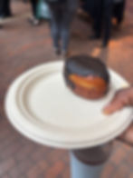 Vegan Boston Cream Donut with coconut and vanilla filling, topped with chocolate sauce.