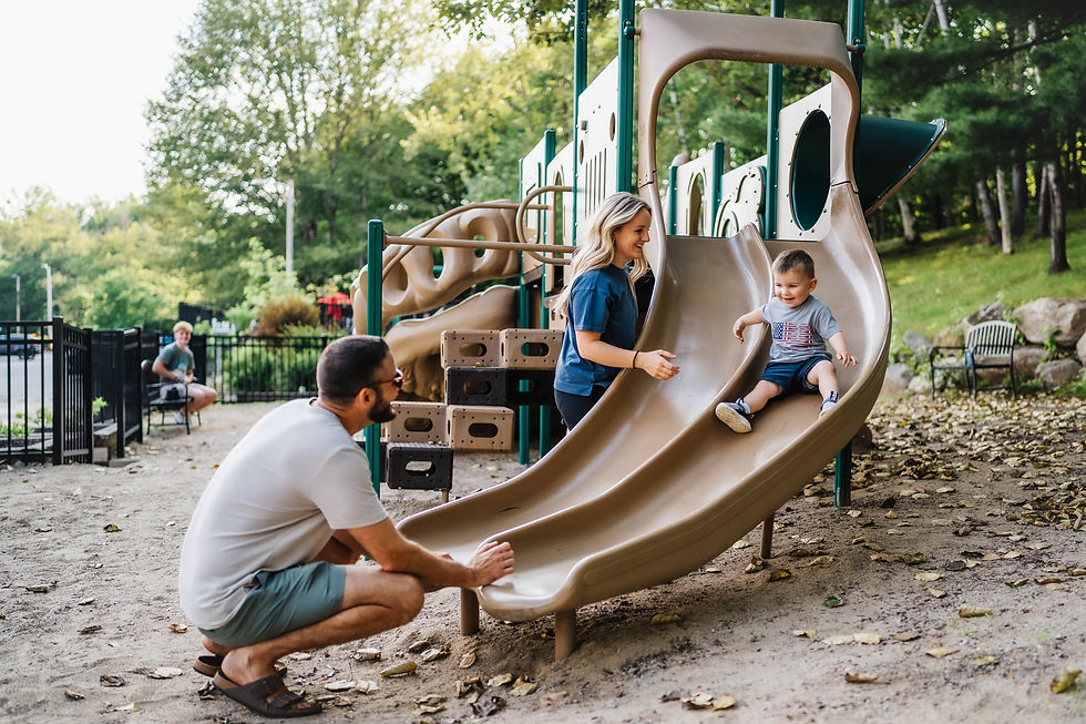 Family enjoying the outdoor play area at a kid friendly vacation rental in the white mountains