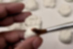 Brushing Baby Oil Over Clay
