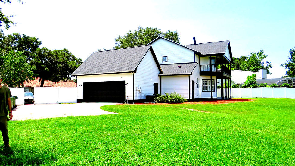 Eye-level view of a home inspector examining a roof for wind mitigation in Tampa