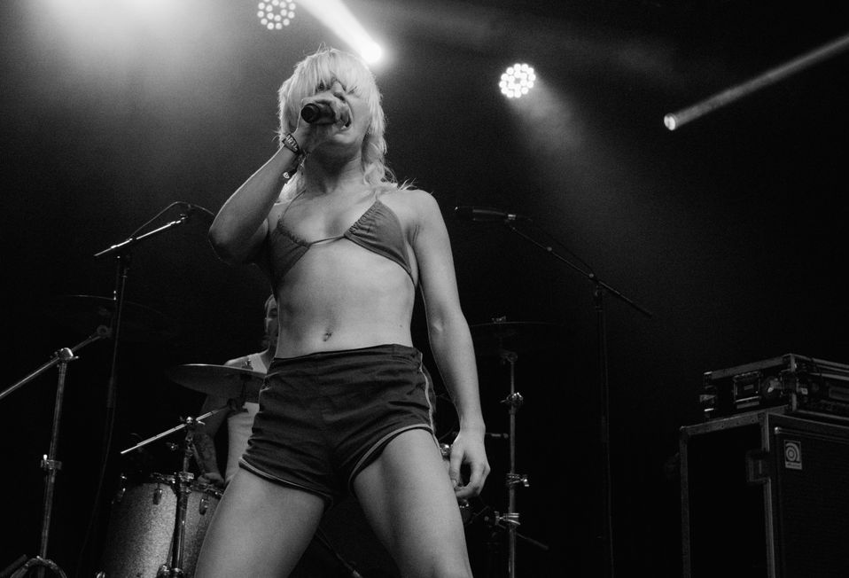 Amy Taylor of Amyl and The Sniffers singing on stage during their performance at Shaky Knees 2022 in Atlanta, Ga.