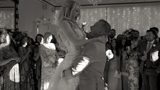 First dance at Highley Manor. Bride is being dipped by groom on the dancefloor. Photo in black and white and captured during filming a wedding video at Highley Manor