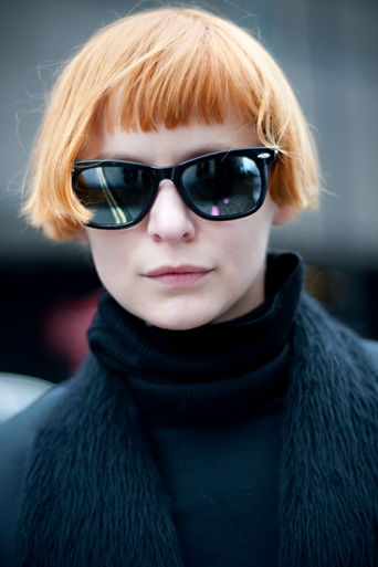 Photographer Nedim Nazerali takes a portrait an anonymous passer by during London Fashion Week.