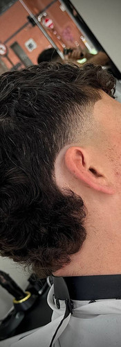 Modern mullet fade haircut with sharp taper at Creato Barber & Bar Liverpool