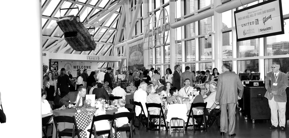 Guests gathered at tables in a spacious event hall