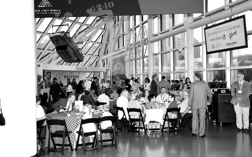Guests gathered at tables in a spacious event hall