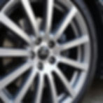 Close-up of a clean car wheel after detailing services.