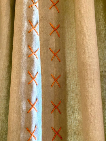 Contrast stitch curtain leading edge border