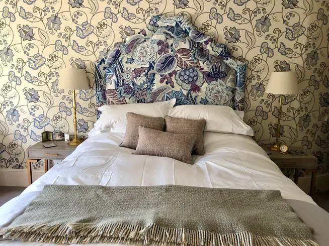 A detailed flowery shaped headboard.