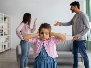 Parents arguing in background, child upset