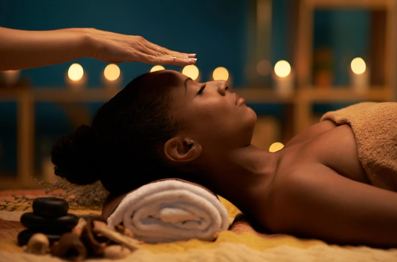 a woman is getting a scalp massage with her eyes closed