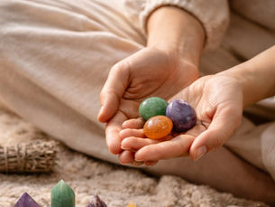 Holding gemstones while setting intentions