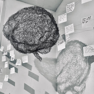 Marina Berlin’s Memento is an immersive wire mesh and AI art installation exploring collective consciousness, human connection, and technology. A suspended wire brain becomes the center of a participatory installation where visitors contribute handwritten hopes and reflections that are woven into the sculpture and transformed through artificial intelligence.
