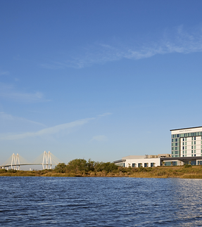 Baytown Waterfront Hotel with Fred Hartman Bridge.png