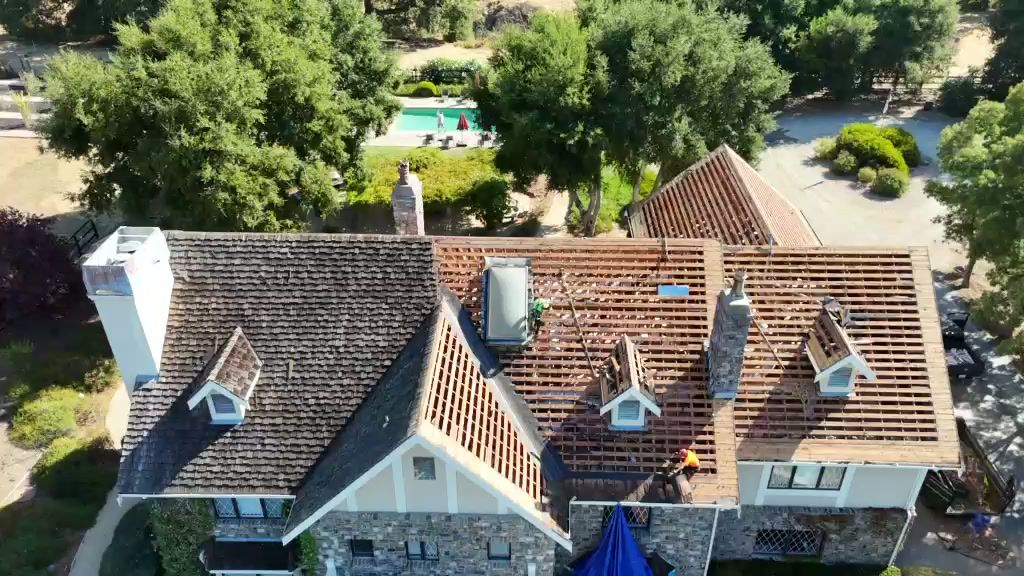 Aerial views of tile roofing, roof work and protective coverings