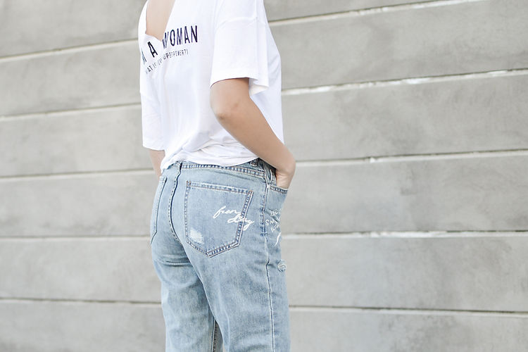 A Woman in Jeans and T-shirt