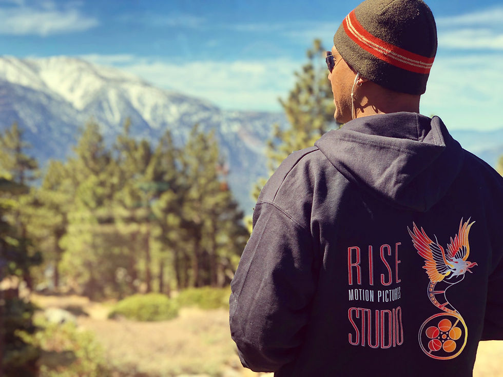 man in rise motion pictures studio hoodie