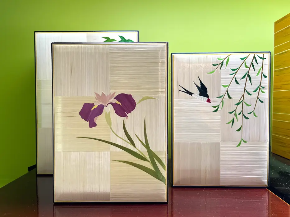 Three finished Mugiwara Zaiku straw craft panels