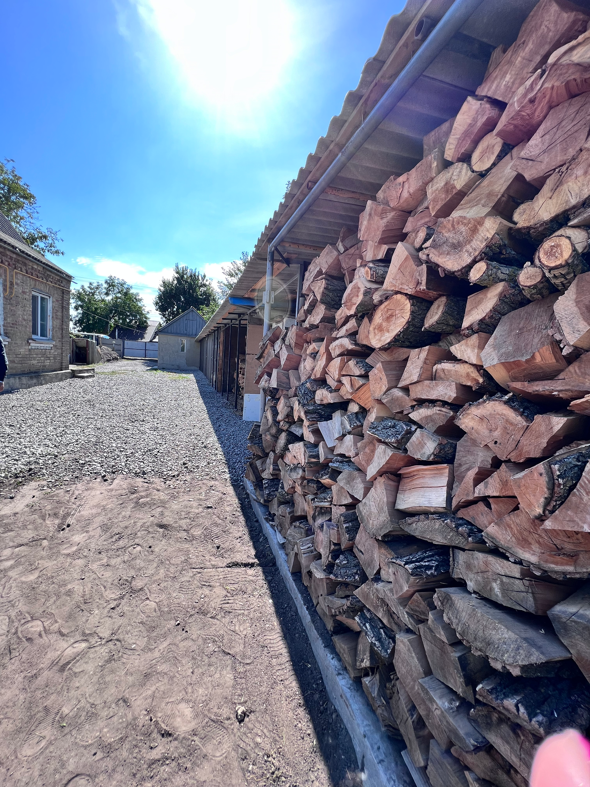 Long Pile of Stacked Firewood