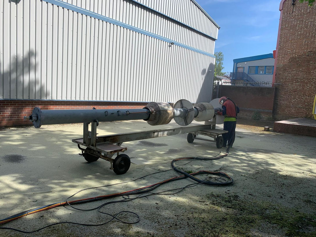 Shot blasting a Battleship Antenna