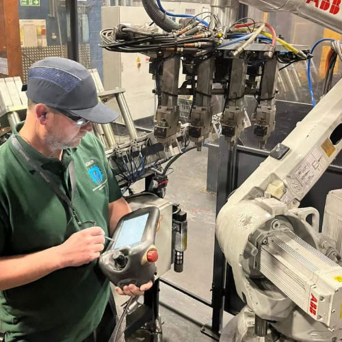 a man diagnosing a mechanical problem