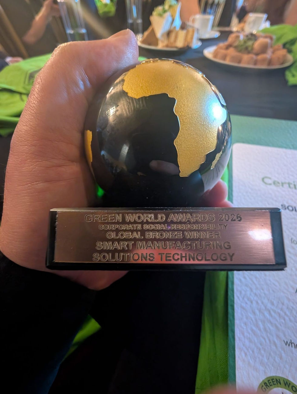 Close up of Green World Awards 2026 bronze winner trophy for corporate social responsibility