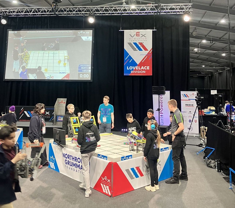 photo of children and teachers at a display stand in an exhibition
