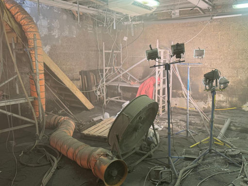 flood light and extraction equipment in a dusty basement