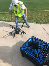 Drone pilot setting up Matrice drone