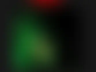 A man with red goggles in a green background 