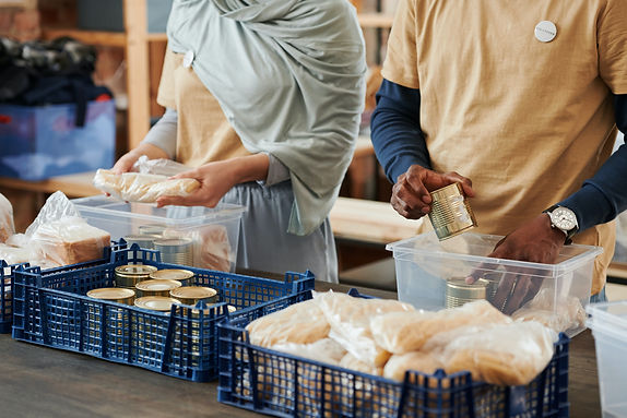 Volunteers packaging food