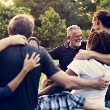 Group of people hugging in a circle
