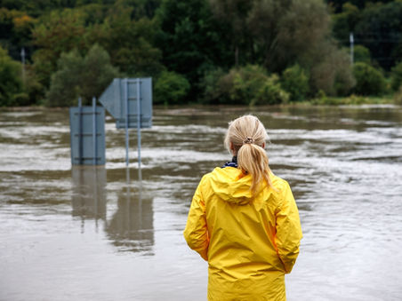 Woman overlooking flooded street