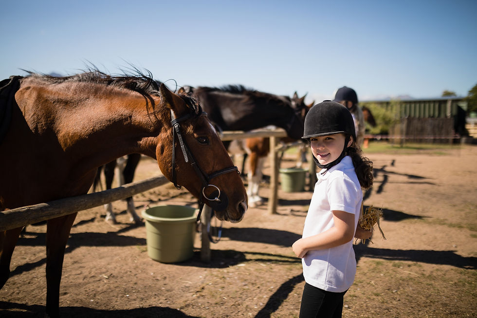smiling-girl-standing-near-the-horse-in-ranch-2025-04-03-15-43-10-utc.jpg
