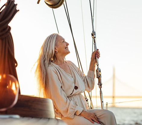 beautiful-senior-woman-boat-sailing-sea-against-sky_edited.jpg