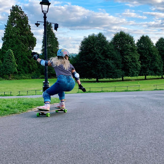 Woman longboard sliding in Ashton Court